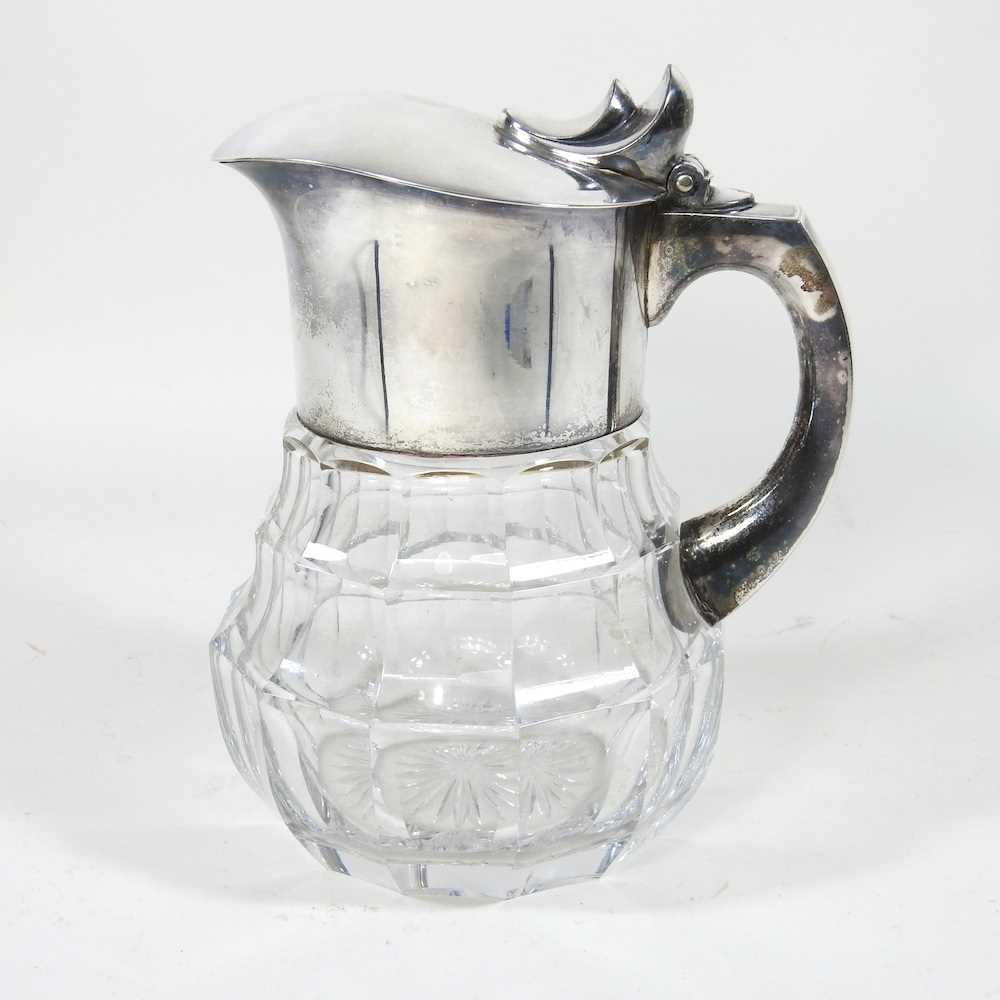 Lot 89 - A glass claret jug, with silver plated mounts,...