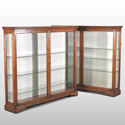 Lot 247 - A pair of 20th century glazed oak dwarf display cabinets