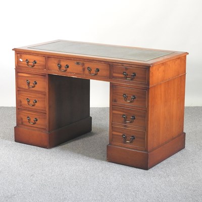 Lot 760 - A reproduction yew wood pedestal desk, with an...