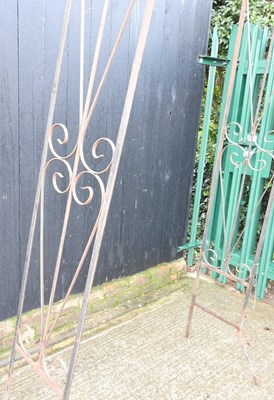 Lot 669 - A black painted wrought iron garden arch,...