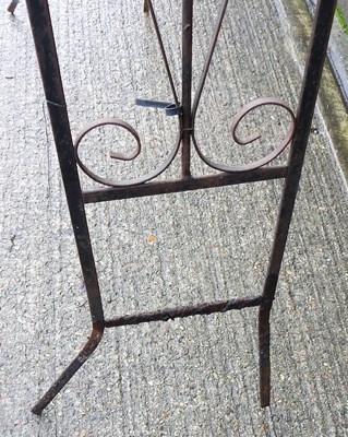 Lot 669 - A black painted wrought iron garden arch,...