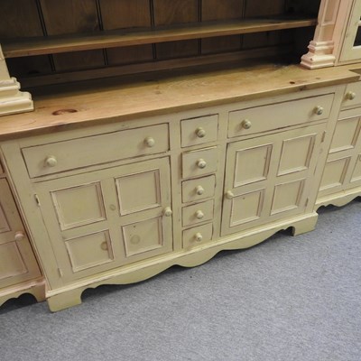 Lot 35 - A large 20th century cream painted and pine breakfront dresser