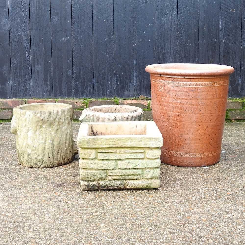 Lot 423 - A pair of cast stone garden pots, together...