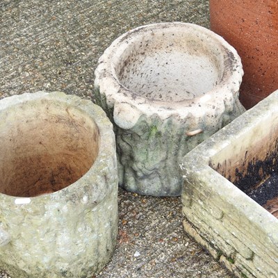 Lot 423 - A pair of cast stone garden pots, together...