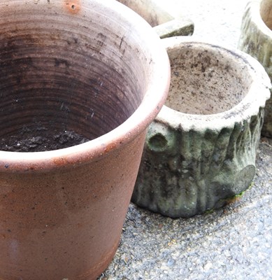 Lot 423 - A pair of cast stone garden pots, together...