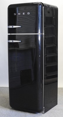 Lot 638 - A black Smeg fridge freezer