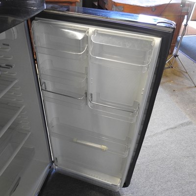 Lot 638 - A black Smeg fridge freezer