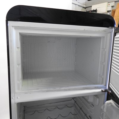 Lot 638 - A black Smeg fridge freezer