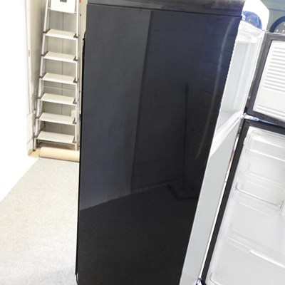 Lot 638 - A black Smeg fridge freezer