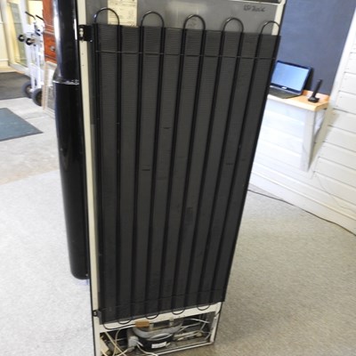 Lot 638 - A black Smeg fridge freezer