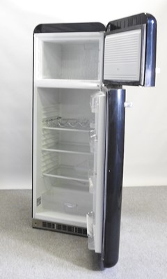 Lot 638 - A black Smeg fridge freezer