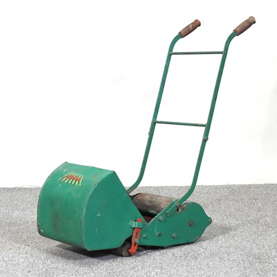 Lot 418 - A vintage Webb miniature push along toy lawn...