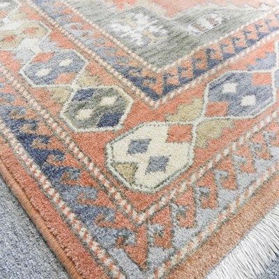 Lot 710 - A modern woollen rug, 193 x 139, together with...