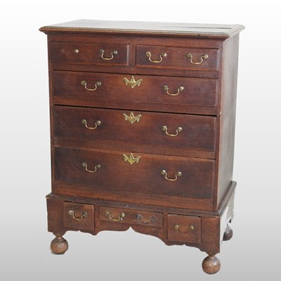 Lot 310 - An 18th century oak chest on stand