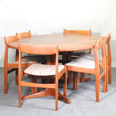 Lot 451 - A 1970's teak extending dining table, together...