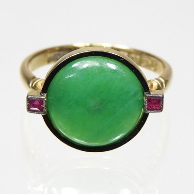 Lot 386 - An 18 carat gold jade ring, set with two...