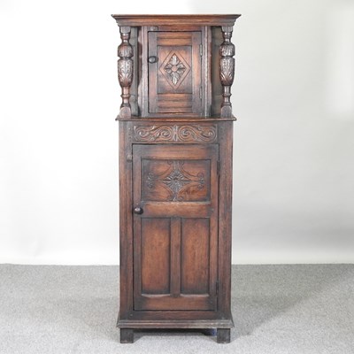 Lot 468 - A mid 20th century carved oak court cupboard,...