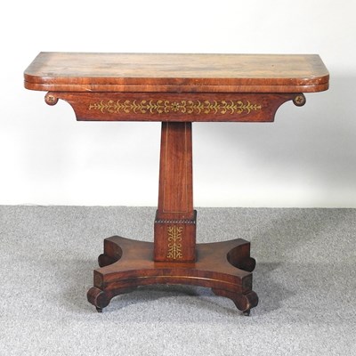 Lot 380 - A Regency rosewood and cut brass inlaid...