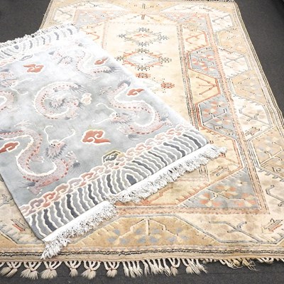 Lot 245 - A modern oriental woollen carpet, on a cream ground