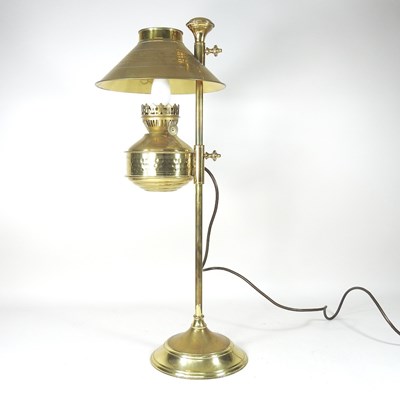 Lot 146 - A brass table lamp, in the form of a Victorian...