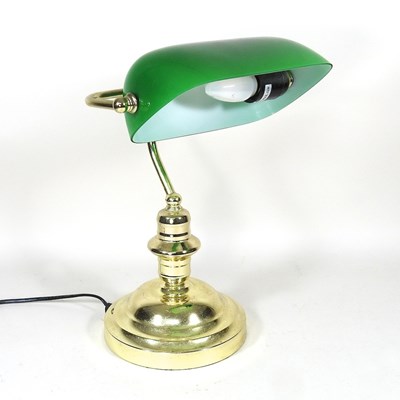 Lot 44 - A brass desk lamp, with an adjustable green...