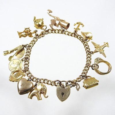 Lot 59 - A 9 carat gold curb link charm bracelet,...