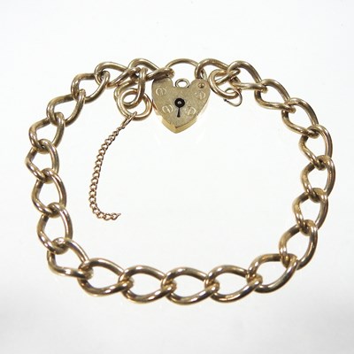 Lot 449 - A 9 carat gold curb link bracelet, the padlock...