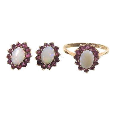 Lot 534 - A 9 carat gold opal and ruby cluster ring,...