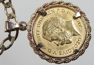 Lot 8 - A 9 carat gold pendant, with a George V half...