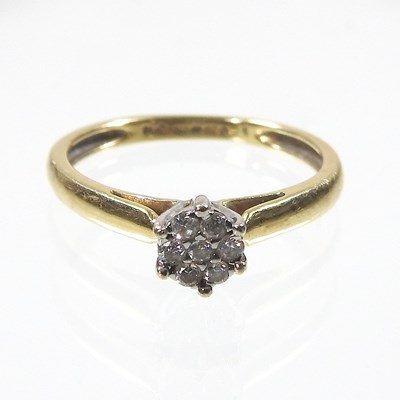 Lot 577 - An 18 carat gold diamond set cluster ring, set...