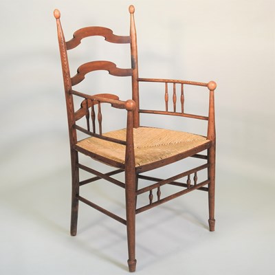 Lot 253 - An Arts and Crafts oak armchair