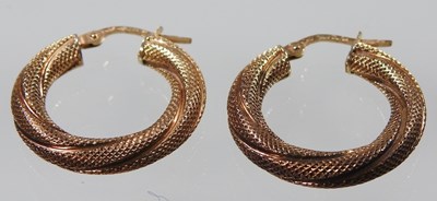 Lot 255 - A pair of 9 carat gold hoop earrings, of...