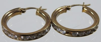 Lot 255 - A pair of 9 carat gold hoop earrings, of...