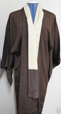 Lot 56 - A brown striped kimono, together with another (2)