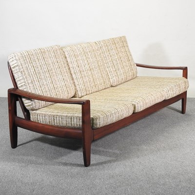 Lot 33 - A 1970's Danish style teak three seater sofa,...