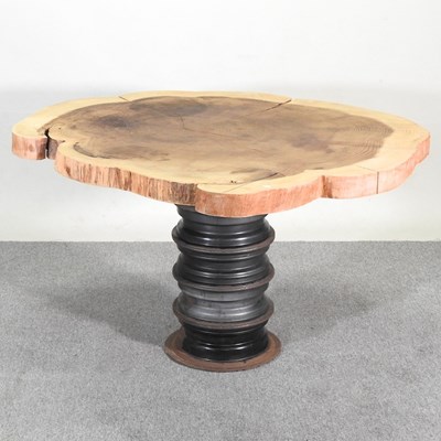 Lot 365 - A rustic dining table, with a natural top, on...