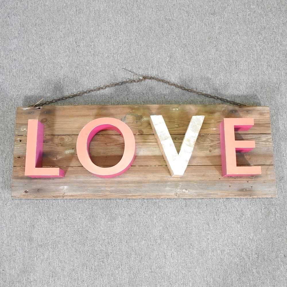 Lot 337 - A rustic wooden Love sign, 117cm wide