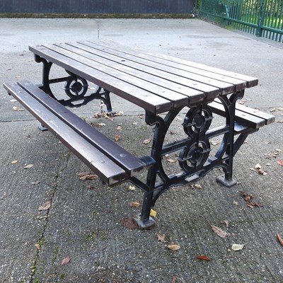 Lot 425 - A large cast iron garden bench, with a...