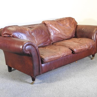 Lot 287 - A modern brown leather upholstered sofa, on...