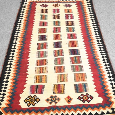 Lot 373 - A Persian qashqai kilim, with coloured squares,...