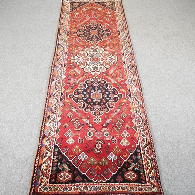 Lot 99 - A Persian qashqai runner, with floral designs,...