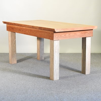 Lot 434 - A rustic pine kitchen table, on square legs