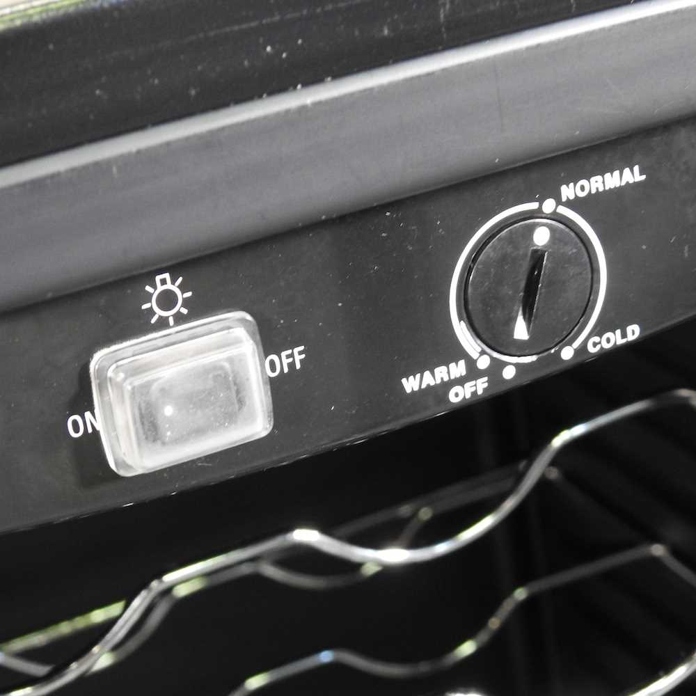 Lot 10 A Logik wine fridge, with a glazed door