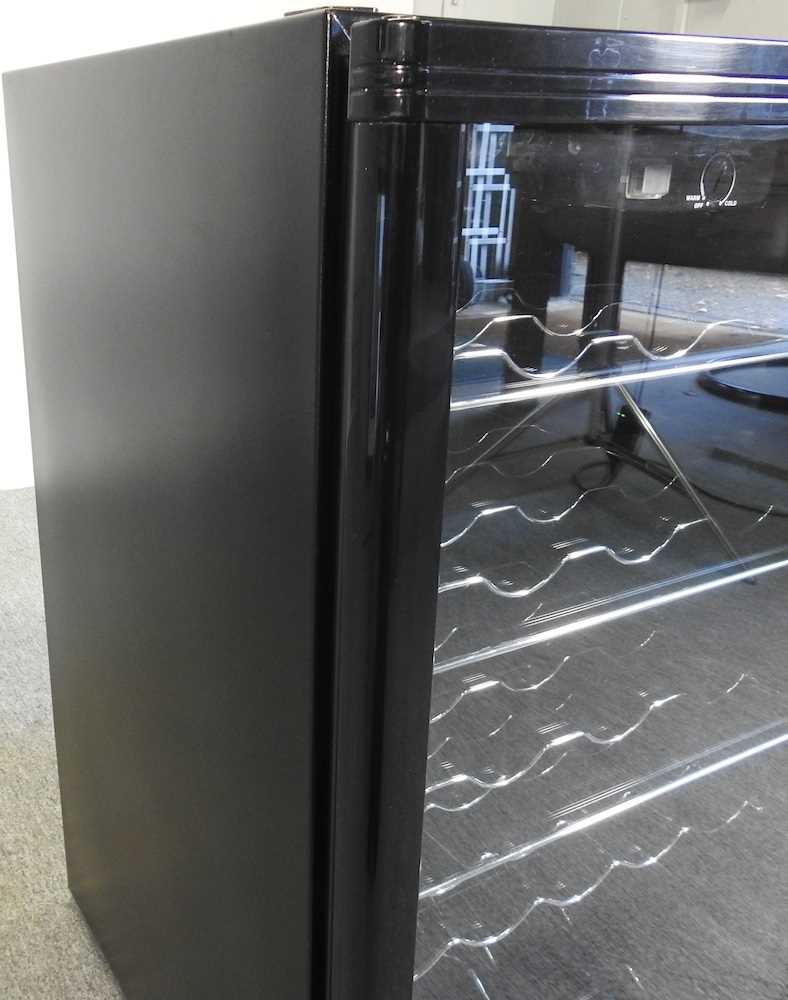 Lot 10 A Logik wine fridge, with a glazed door