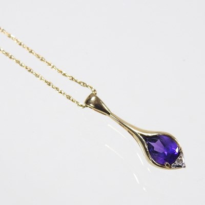 Lot 242 - A 9 carat gold tanzanite pendant necklace, on...