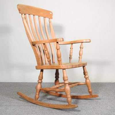 Lot 190 - A beech splat back rocking chair