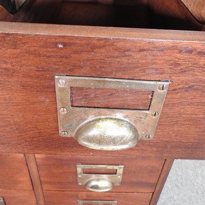 Lot 167 - A mid 20th century hardwood filing chest,...