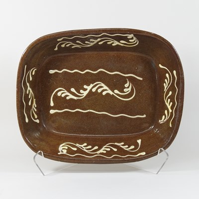 Lot 271 - A 19th century Staffordshire slipware baking dish