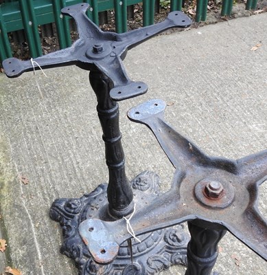 Lot 513 - A pair of cast iron table bases, 70cm high (2)