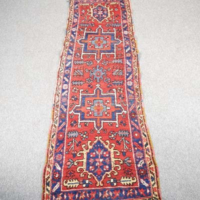 Lot 661 - A Caucasian woollen runner, with four central...